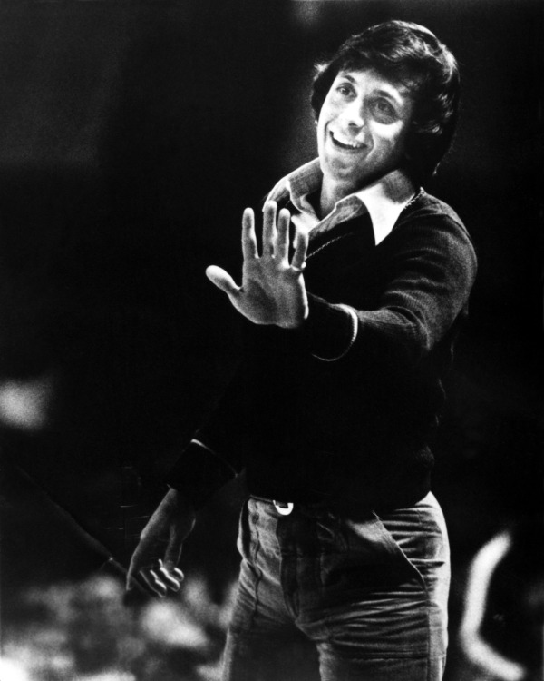 Larry Brown talks with his team