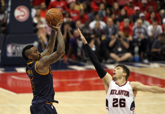 May 20, 2015; Atlanta, GA, USA; Cleveland Cavaliers guard J.R. Smith (5) shoots against Atlanta Hawks guard Kyle Korver (26) during the fourth quarter of game one of the Eastern Conference Finals of the NBA Playoffs at Philips Arena. Mandatory Credit: Brett Davis-USA TODAY Sports