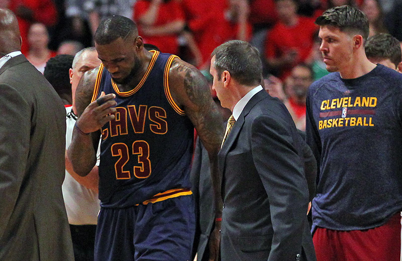 May 10, 2015; Chicago, IL, USA; Cleveland Cavaliers forward LeBron James (23) talks with head coach David Blatt after appearing to be injured in the second half of game four of the second round of the NBA Playoffs against the Chicago Bulls at the United Center. Cleveland won 86-84. Mandatory Credit: Dennis Wierzbicki-USA TODAY Sports