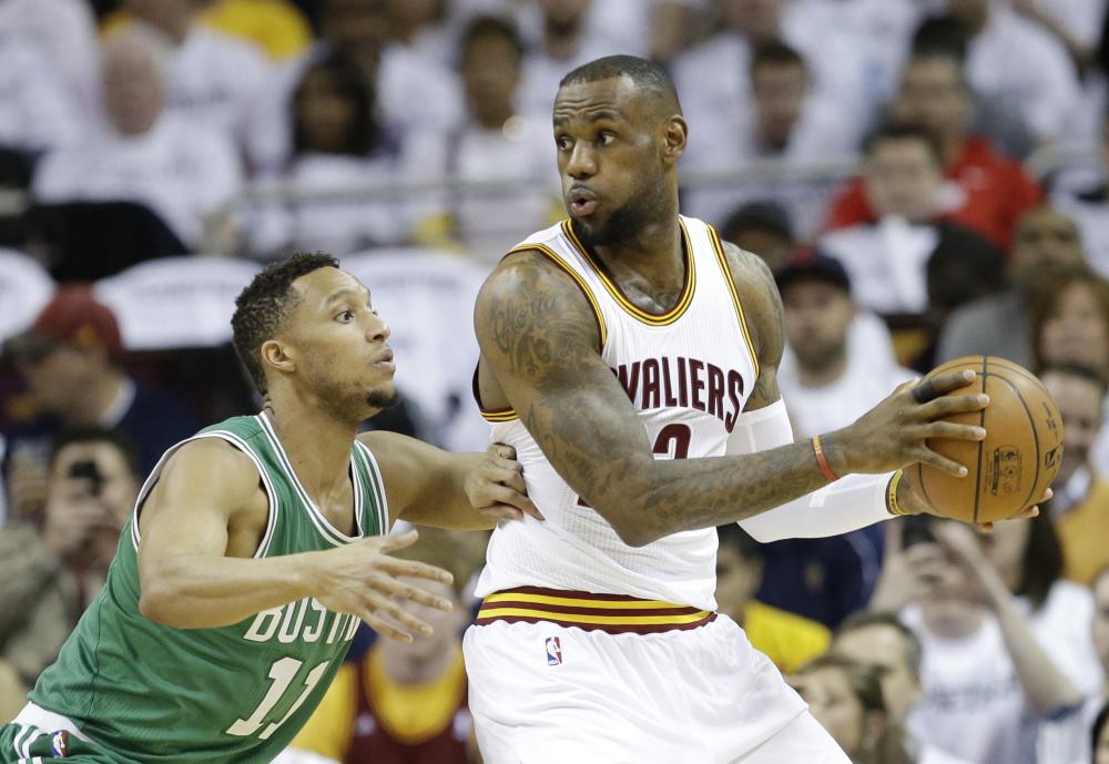 Cleveland Cavaliers' LeBron James (23) drives past Boston Celticsí Evan Turner (11) in the first quarter of a first-round NBA playoff basketball game Tuesday, April 21, 2015, in Cleveland. (AP Photo/Mark Duncan) ORG XMIT: OHTD10