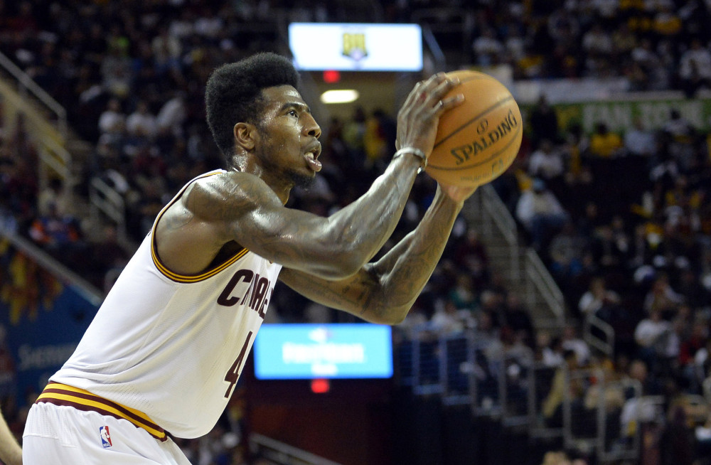 Apr 15, 2015; Cleveland, OH, USA; Cleveland Cavaliers guard Iman Shumpert (4) shoots in the fourth quarter against the Washington Wizards at Quicken Loans Arena. Mandatory Credit: David Richard-USA TODAY Sports ORG XMIT: USATSI-188682 ORIG FILE ID:  20150415_ajw_ar7_326.jpg