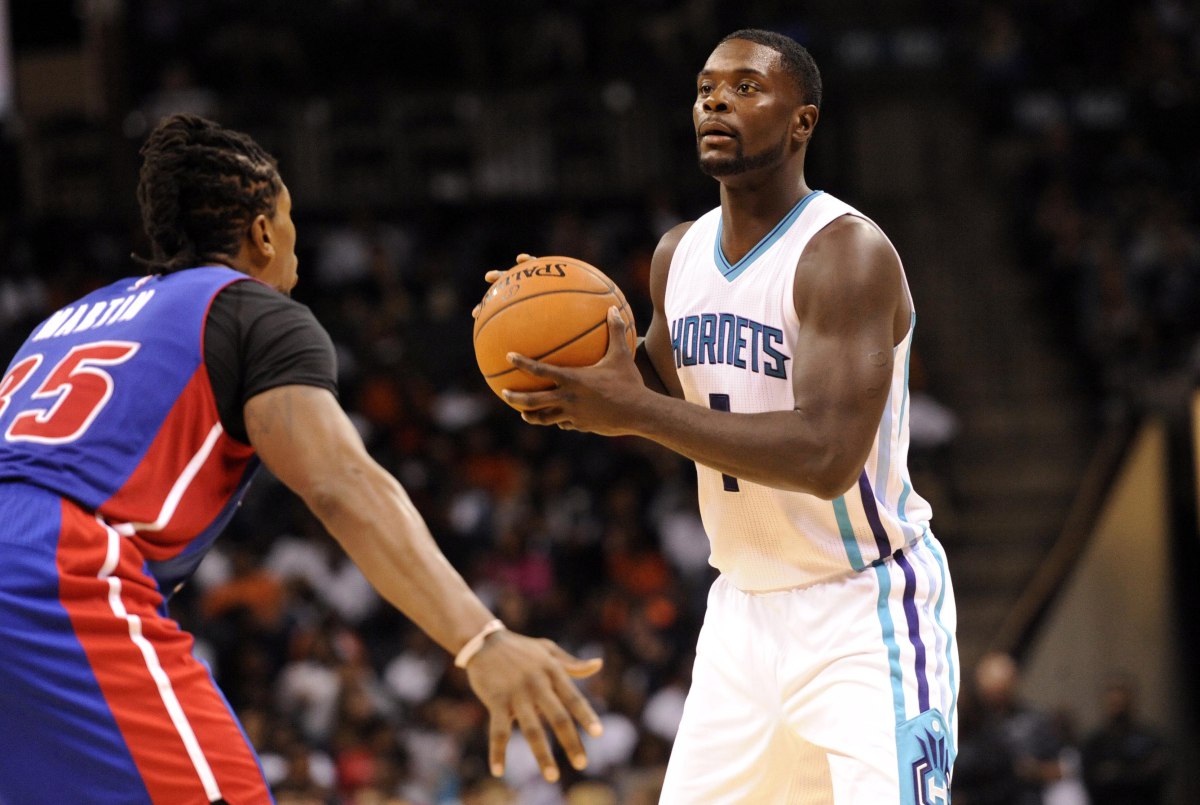 Oct 15, 2014; Charlotte, NC, USA; Charlotte Hornets guard Lance Stephenson (1) looks to pass the ball as he is defended by Detroit Pistons forward Cartier Martin (35) during the second half at Time Warner Cable Arena. Pistons win 104-84. Mandatory Credit: Sam Sharpe-USA TODAY Sports ORG XMIT: USATSI-189214 ORIG FILE ID:  20141015_jla_ss1_188.jpg