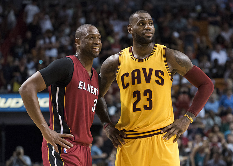 Mar 19, 2016; Miami, FL, USA; Miami Heat guard Dwyane Wade (3) talks with Cleveland Cavaliers forward LeBron James (23) during the second half at American Airlines Arena. The Heat won 122-101. Mandatory Credit: Steve Mitchell-USA TODAY Sports