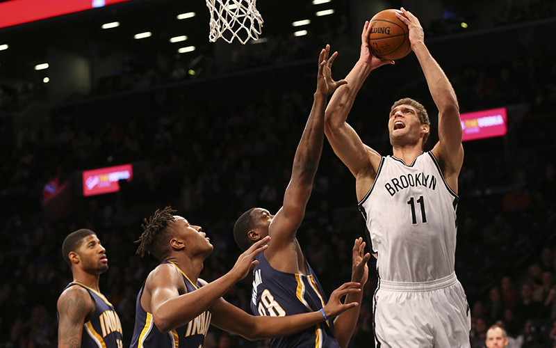 Mar 26, 2016; Brooklyn, NY, USA; Brooklyn Nets center Brook Lopez (11) reaches for the net during the third quarter against the Indiana Pacers at Barclays Center. Brooklyn Nets won 120-110. Mandatory Credit: Anthony Gruppuso-USA TODAY Sports