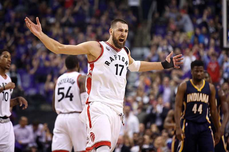 Apr 18, 2016; Toronto, Ontario, CAN; Toronto Raptors center Jonas Valanciunas (17) celebrates after making a basket against the Indiana Pacers in game two of the first round of the 2016 NBA Playoffs at Air Canada Centre. Mandatory Credit: Tom Szczerbowski-USA TODAY Sports