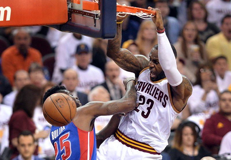 Apr 20, 2016; Cleveland, OH, USA; Cleveland Cavaliers forward LeBron James (23) slam dunks over Detroit Pistons forward Reggie Bullock (25) during the second quarter in game two of the first round of the NBA Playoffs at Quicken Loans Arena. Mandatory Credit: Ken Blaze-USA TODAY Sports